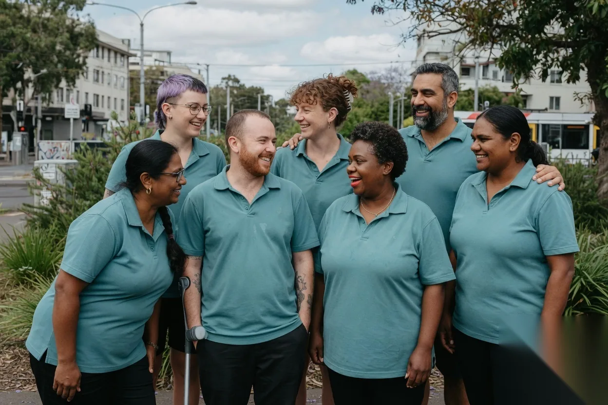 Support team standing together outdoors